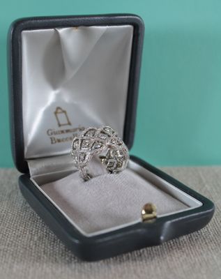 a ring in a box that is sitting on a table