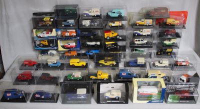 many different types of toy cars in a display case