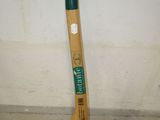 a baseball bat that is laying on the ground