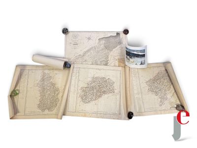 three old maps on a table with a cup of coffee