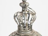 a silver plate with a crown on top of it