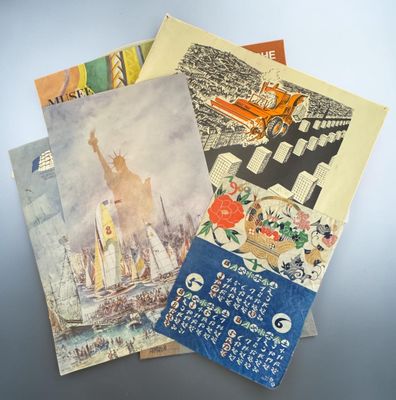 a lot of postcards that are on a table