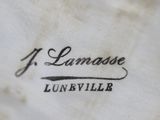 close up of a logo on a white shirt that says j lamarasee