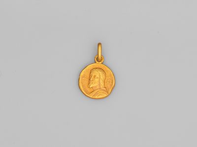 une pièce d'or portant le portrait d'un homme