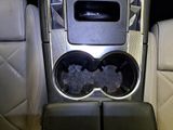a picture of a cup holder in the center of a car
