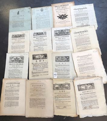 several old books are stacked on top of each other on a table
