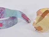 two pieces of paper that have been cut into pieces