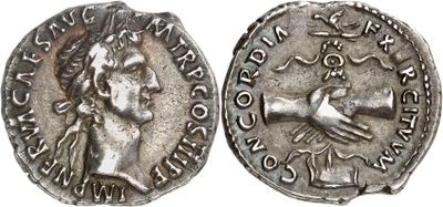 a silver coin with an image of a woman on it