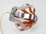 an orange and silver object with a wire attached to it