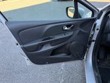 the door of a car is open on the side of the road