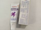 a tube of toothpaste next to a tube of toothpaste
