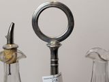 three glass vases that are sitting next to each other