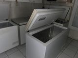 a white chest freezer sitting inside of a kitchen