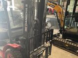 a picture of a forklift truck parked in a warehouse