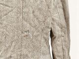 an image of a woman wearing a jacket with a button down