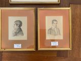 three framed portraits of men are displayed on a wooden wall