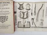 an old book with a bunch of different things inside of it