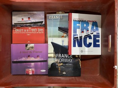 many books in a wooden box on a shelf