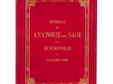 a red book with gold lettering on the cover