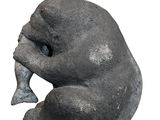 a statue of a bear that is sitting on the ground