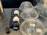 a counter with a variety of containers and containers on it