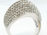 a close up of a diamond ring on a white background