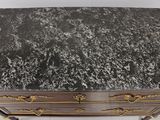an image of a marble top desk with gold trimming