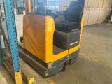 a forklift that is parked in a warehouse