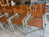 a lot of chairs that are sitting in a room