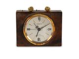 a small clock that is sitting on a table