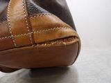 a close up view of a purse on a table
