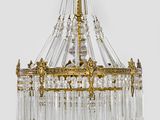 a close up of a chandelier hanging from a ceiling