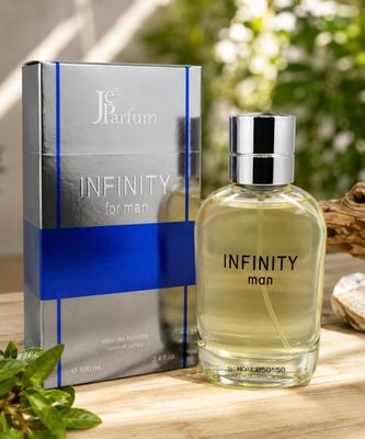 a bottle of perfume sitting on top of a wooden table next to a box
