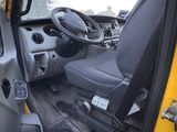a view of the inside of a truck from the driver ' s seat