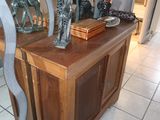 a table with a mirror and a vase on top of it