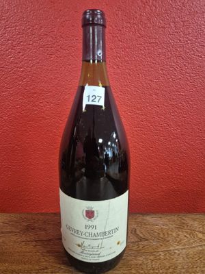 a bottle of wine that is sitting on a table