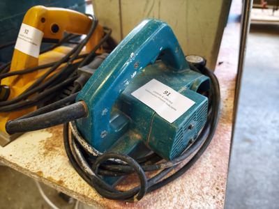 a blue machine that is sitting on a table