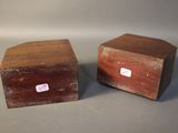 pair of wooden boxes with labels on them sitting on a table