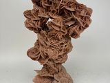 a brown vase with a bunch of flowers in it