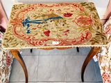 a small table that has a bird on it