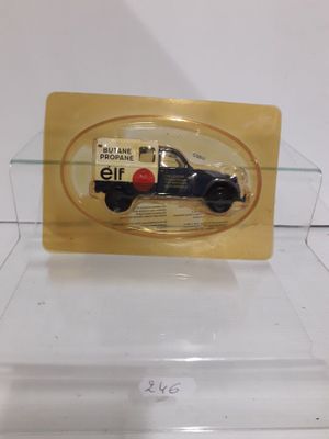 a small black car in a clear display case