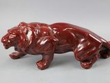 an image of a figurine of a lion on a white background