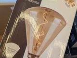 a box with a light bulb on top of a laptop