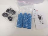 a box with a remote control and some other items on the table