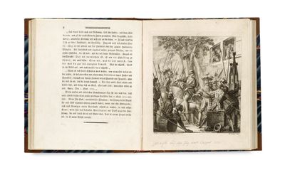 an open book with a black and white drawing of a man on horseback
