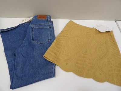 two pairs of blue and yellow jeans on a white surface