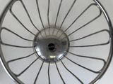a close up view of a metal wheel with spokes