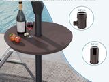 a table with a bottle of wine and a glass of wine on it