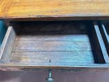 an old wooden drawer with a drawer on top of it