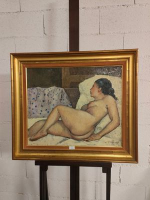 une peinture représentant une femme nue allongée sur un lit
